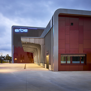 Photo of a wooden building with a red façade.