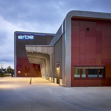 Photo of a wooden building with a red façade.