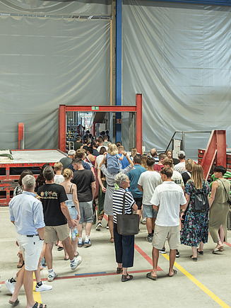 Numerous families visiting the company premises.