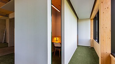 Photo of a hallway. You can see a LENO ADD wooden exterior wall.