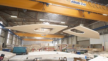 Photo of LENO cross-laminated timber elements in the ZÜBLIN Timber production hall.