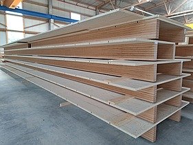 Photo of a stack of ribbed elements in the ZÜBLIN Timber production hall.