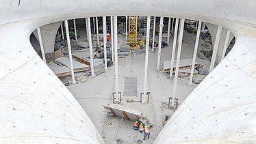 Photo of a chalice column eye of the Stuttgart21 project from above. Everyday construction site life.