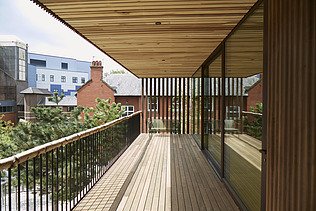 Photo of a wooden terrace with wooden roofing.