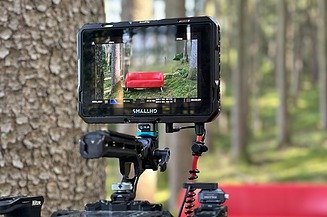 Photo of a camera display with a red couch.