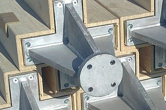 LENO-KIT from ZÜBLIN Timber Photo of wooden beams with built-in steel parts.