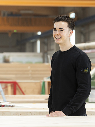 Photo of a young man in production at ZÜBLIN Timber.