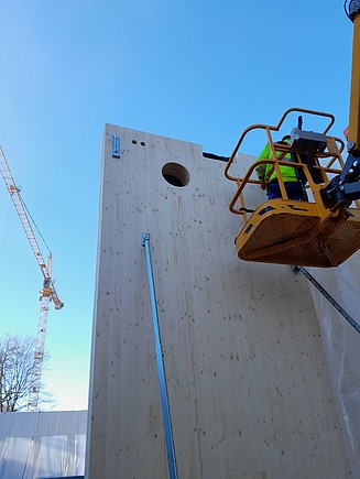 Installation of a CLT interior wall element, which is a corridor wall.  