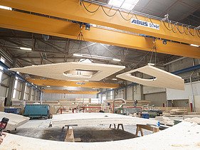 Photo of LENO cross-laminated timber elements in the ZÜBLIN Timber production hall.