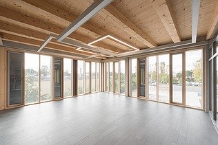 Photo of the Flexim Berlin shell from the inside. Can be seen: Wooden ceiling and façade.