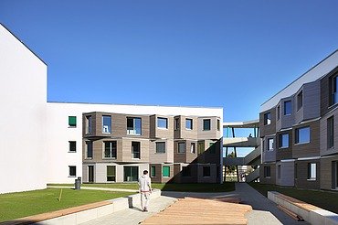 Student Village Adlershof Berlin Photo of the Adlershof student village in Berlin. You can see several wooden buildings.