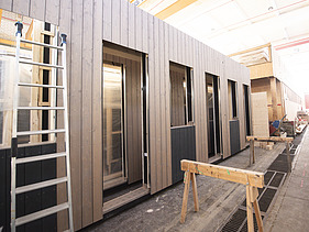 Photo of a timber frame construction element in the ZÜBLIN Timber production hall.