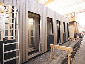 Photo of a timber frame construction element in the ZÜBLIN Timber production hall.