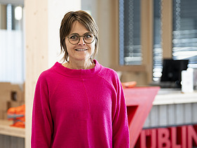 Photo of Andrea in profile.