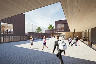 Außenaufnahme der Schule am Hang, Frankfurt. Man sieht ein großes Gebäude.