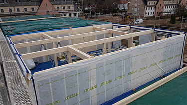 Photo of the Collegium Academicum in Heidelberg during assembly. You can see wooden elements.