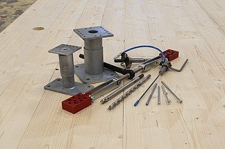 Fasteners from ZÜBLIN Timber Photo of tools and fasteners on a LENO cross-laminated timber panel.