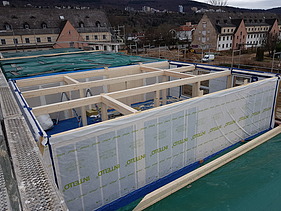 Photo of the Collegium Academicum in Heidelberg during assembly. You can see wooden elements.