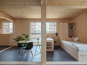 Photo of the Collegium Academicum in Heidelberg. You can see a furnished room with many wooden surfaces.