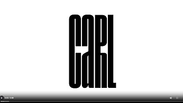 Foto eines weißen PC-Bildschirmes mit schwarzem Schriftzug.